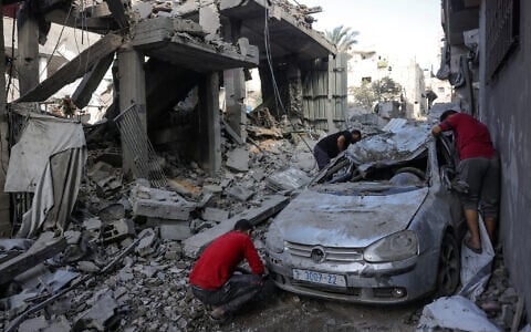 Palestinians check the destruction following Israeli strikes in Jabaliya's Saftawi neighborhood in the northern Gaza Strip on May 22, 2025. (Bashar Taleb/AFP)