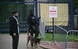 A K-9 unit arrives at the Israeli Embassy in Washington, DC, on May 22, 2025, following a shooting that left Yaron Lischinsky and Sarah Lynn Milgrim dead on May 21. (Brendan SMIALOWSKI / AFP)