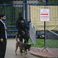 A K-9 unit arrives at the Israeli Embassy in Washington, DC, on May 22, 2025, following a shooting that left Yaron Lischinsky and Sarah Lynn Milgrim dead on May 21. (Brendan SMIALOWSKI / AFP)