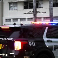 A police car patrols near a Chabad center in Miami Beach, Florida, May 22, 2025, following a shooting that left two people dead, in Washington, DC. (Chandan Khanna/AFP)