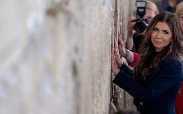 US Homeland Security Secretary Kristi Noem pauses after placing a note at the Western Wall in the Old City of Jerusalem, during a visit on May 25, 2025. (Alex Brandon / POOL / AFP)
