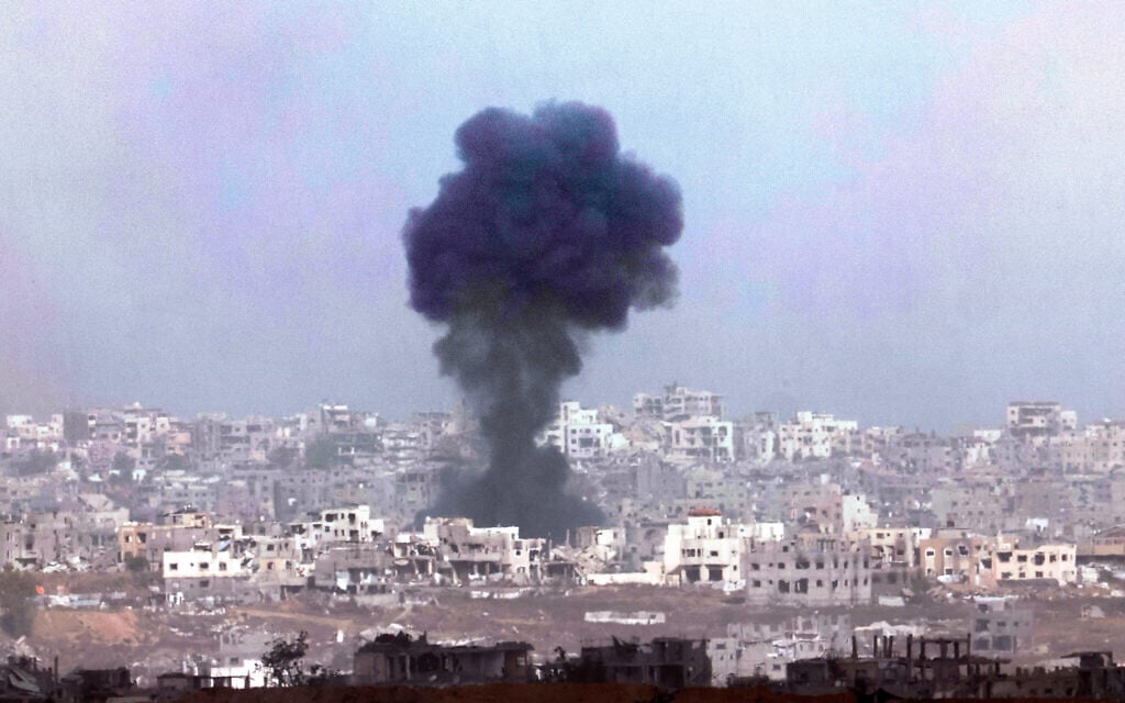 This picture taken from a position in southern Israel, on the border with the Gaza Strip, shows smoke billowing above destroyed buildings during an Israeli bombardment on May 27, 2025. (Jack GUEZ / AFP)