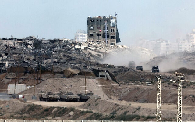 This picture taken from a position in southern Israel, on the border with the Gaza Strip, shows Israeli vehicles returning after operations on May 27, 2025. (Jack GUEZ / AFP)