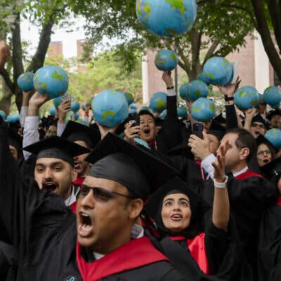 Graduates from Harvard Kennedy School hold globes as they celebrate during their commencement ceremony on May 29, 2025 in Cambridge, Massachusetts. (Libby O'Neill/Getty Images/AFP) Graduates from Harvard Kennedy School hold globes as they celebrate during their commencement ceremony on May 29, 2025 in Cambridge, Massachusetts. (Libby O'Neill/Getty Images/AFP)
