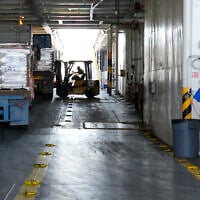 Illustrative: A worker unloads Gaza aid from a truck inside a US ship at the port of Larnaca, Cyprus, June 26, 2024. (AP Photo/Petros Karadjias)