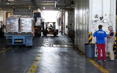 Illustrative: A worker unloads Gaza aid from a truck inside a US ship at the port of Larnaca, Cyprus, June 26, 2024. (AP Photo/Petros Karadjias)