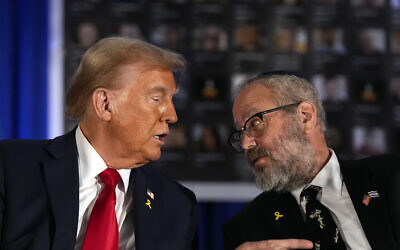 Then-Republican presidential nominee President Donald Trump talks with Rabbi Yehuda Kaploun at an event marking one year since the October 7 Hamas atrocities, October 7, 2024, in Miami. (AP Photo/Alex Brandon)