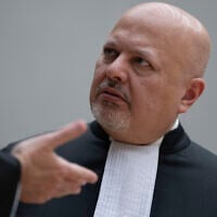 Chief Prosecutor Karim Khan talks while waiting for former Philippine President Rodrigo Duterte to appear via video link before the International Criminal Court (ICC) in The Hague on March 14, 2025. (AP Photo/Peter Dejong, Pool)