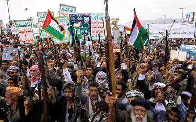 Houthi supporters chant slogans during a weekly anti-US and anti-Israel rally in Sanaa, Yemen, on April 18, 2025. Some of the placards bear the group's slogan "God is the greatest, Death to America, Death to Israel, a Curse on the Jews, Victory to Islam." (AP Photo/Osamah Abdulrahman)