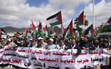 Moroccans protest the docking of a Maersk cargo ship carrying airplane parts they suspect are headed to Israel, outside Tangier Med Port on April 20, 2025. Banner in Arabic reads "Stop shipping weapons to the terrorist Zionist entity." (AP Photo/Mosa'ab Elshamy)