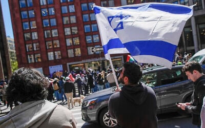 New York University students and Israel supporters demonstrate across the street from a rally of pro-Palestinian students and supporters outside the NYU Stern School of Business building, April 22, 2024, in New York. (AP Photo/Mary Altaffer, File)