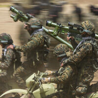 Illustrative: Fighters from the Iran-backed Lebanese terrorist group Hezbollah train in southern Lebanon, May 21, 2023. (AP Photo/Hassan Ammar, File)