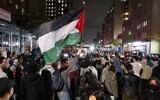 Pro-Palestinian, anti-Israel protesters gather near an area where people were being taken into custody near Columbia University campus in New York, April 30, 2024. (AP/Craig Ruttle)