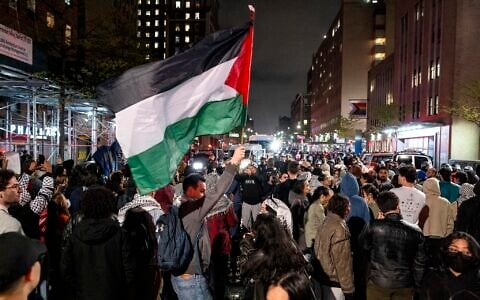 Pro-Palestinian, anti-Israel protesters gather near an area where people were being taken into custody near Columbia University campus in New York, April 30, 2024. (AP/Craig Ruttle)