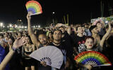 Fans cheer as they watch Lady Gaga's free concert on Copacabana beach, in Rio de Janeiro, Saturday, May 3, 2025. (AP Photo/Bruna Prado)