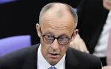 Friedrich Merz reacts after he was not elected new chancellor in the first voting process at the parliament Bundestag in Berlin, May 6, 2025. (AP Photo/Markus Schreiber)