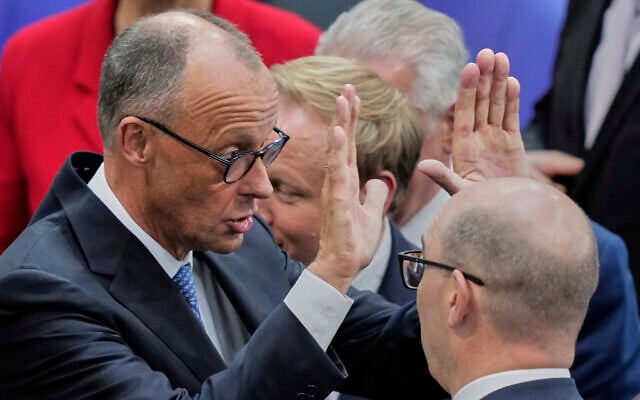 The leader of the Christian Democrats, Friedrich Merz, reacts after being elected chancellor by the Bundestag, at the Reichstag building in Berlin, Germany, May 6, 2025. (AP Photo/Ebrahim Noroozi)