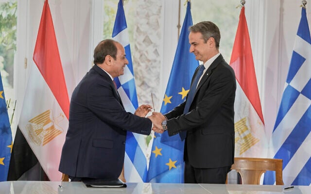 Egyptian President Abdel-Fattah el-Sissi, left, and Greece's Prime Minister Kyriakos Mitsotakis, shake hands after signing bilateral agreements during their meeting in Athens, May 7, 2025. (AP/Petros Giannakouris)