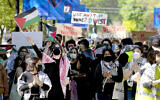 FILE- Pro-Palestinian protesters demonstrate on the campus of DePaul University, April 30, 2024, in Chicago. (AP Photo/Charles Rex Arbogast, file)