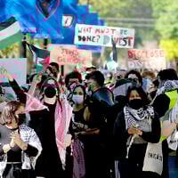 FILE- Pro-Palestinian protesters demonstrate on the campus of DePaul University, April 30, 2024, in Chicago. (AP Photo/Charles Rex Arbogast, file)