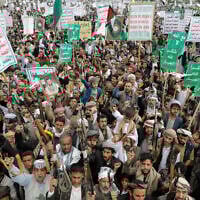 Supporters of the Iran-backed Houthi group in Yemen attend a weekly anti-US and anti-Israel rally in the rebel-held capital Sanaa, on May 9, 2025. (AP Photo/Osamah Abdulrahman)