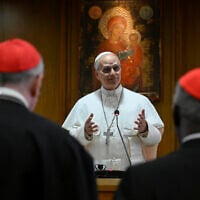 Pope Leo XIV meets the College of Cardinals in the New Synod Hall at the Vatican, Saturday, May 10, 2025. (Vatican Media via AP)