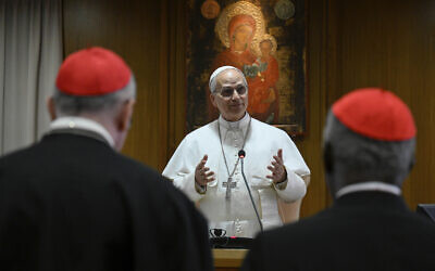 Pope Leo XIV meets the College of Cardinals in the New Synod Hall at the Vatican, Saturday, May 10, 2025. (Vatican Media via AP)