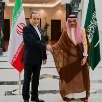 Iranian Foreign Minister Abbas Araghchi, left, shakes hands with his Saudi counterpart Prince Faisal bin Farhan during their meeting in Jeddah, Saudi Arabia, May 10, 2025. (Iranian Foreign Ministry via AP)