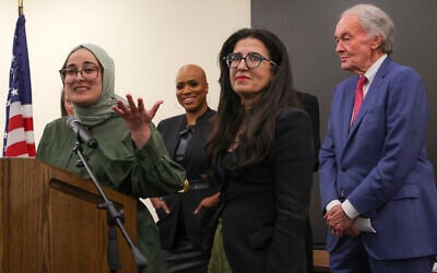 Tufts University student from Turkey, Rumeysa Ozturk, left, who was arrested by immigration agents while walking along a street in a Boston suburb, talks to reporters on arriving back in Boston, May 10, 2025, a day after she was released from a Louisiana immigration detention center on the orders of a federal judge. (Matthew J. Lee/The Boston Globe via AP)