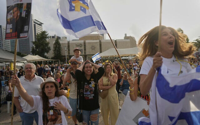 People react as they gather to watch a live broadcast of Israeli-American soldier Edan Alexander to be released from Hamas captivity in Gaza, at a plaza known as the hostages square in Tel Aviv, May 12, 2025 (AP Photo/Oded Balilty)