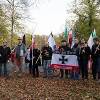 FILE - Participants of a demonstration of Reich citizens carry black and white and other flags in Potsdam, Germany, on November 14, 2020. (Christophe Gateau/dpa via AP, File)