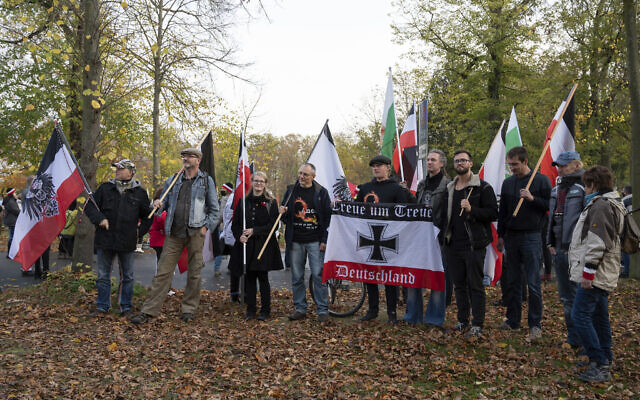 FILE - Participants of a demonstration of Reich citizens carry black and white and other flags in Potsdam, Germany, on November 14, 2020. (Christophe Gateau/dpa via AP, File) FILE - Participants of a demonstration of Reich citizens carry black and white and other flags in Potsdam, Germany, on November 14, 2020. (Christophe Gateau/dpa via AP, File)