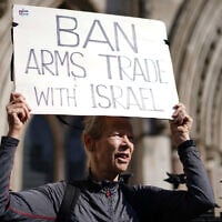Demonstrators gather outside the Royal Courts of Justice in London, where Palestinian human rights organization Al-Haq is taking legal action against the Department for Business and Trade over several decisions, May 13, 2025. (Ben Whitley/PA via AP)