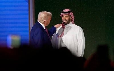 US President Donald Trump shakes hands with Saudi Crown Prince Mohammed bin Salman after his speech at the King Abdulaziz International Conference Center in Riyadh, Saudi Arabia, Tuesday, May 13, 2025. (AP Photo/Alex Brandon)