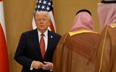 US President Donald Trump arrives for the group photo with Gulf Cooperation Council leaders during the GCC Summit in Riyadh, Saudi Arabia, May 14, 2025. (AP Photo/Alex Brandon)