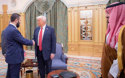 In this photo released by the Saudi Royal Palace, Syria's interim President Ahmad al-Sharaa, left, shakes hands with US President Donald Trump, center, in Riyadh, Saudi Arabia, May 14, 2025. At right is Saudi Crown Prince Mohammed bin Salman. (Bandar Aljaloud/Saudi Royal Palace via AP)