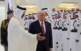 Qatar's Emir Sheikh Tamim bin Hamad Al Thani, left, welcomes US President Donald Trump during an official welcoming ceremony at the Amiri Diwan in Doha, Qatar, May 14, 2025. (AP Photo/Alex Brandon)