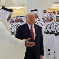 Qatar's Emir Sheikh Tamim bin Hamad Al Thani, left, welcomes US President Donald Trump during an official welcoming ceremony at the Amiri Diwan in Doha, Qatar, May 14, 2025. (AP Photo/Alex Brandon)