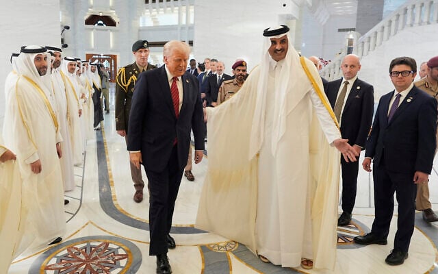 Qatar's Emir Sheikh Tamim bin Hamad Al Thani welcomes US President Donald Trump during an official welcoming ceremony at the Amiri Diwan in Doha, Qatar, May 14, 2025. (AP Photo/Alex Brandon)