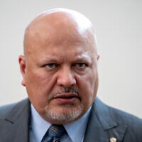 Karim Khan, Prosecutor of the International Criminal Court looks up prior to a press conference in The Hague, Netherlands, July 3, 2023. (Peter Dejong/AP)