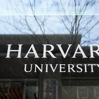 The Harvard University logo is displayed on a building at the school, Tuesday, in Cambridge, Massachusetts, April 15, 2025. (Charles Krupa/AP)