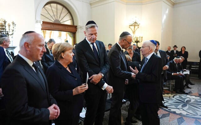 From left: Berlin Mayor Kai Wegner, former German chancellor Angela Merkel, Mathias Döpfner, CEO of Axel Springer SE, Chancellor Friedrich Merz and Josef Schuster, president of the Central Council of Jews in Germany attend the funeral of Holocaust survivor Margot Friedländer, who died at the age of 103, at the Weissensee cemetery in Berlin, May 15, 2025. (Kay Nietfeld/Pool Photo via AP)