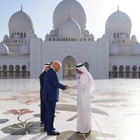 US President Donald Trump (left) shakes hands with Yousif Al Obaidli, director of Sheikh Zayed Grand Mosque, during a tour of the Sheikh Zayed Grand Mosque, Thursday, May 15, 2025, in Abu Dhabi, United Arab Emirates. (AP Photo/Alex Brandon)