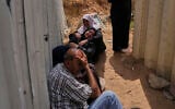 Palestinians mourn their relatives who were killed in Israeli airstrikes on a medical center in Jabalia, northern Gaza Strip, on Thursday, May 15, 2025. (AP Photo/Jehad Alshrafi)