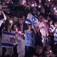 Israeli fans cheer for Yuval Raphael as she performs 'New Day Will Rise' during the second semifinal of the 69th Eurovision Song Contest, in Basel, Switzerland, May 15, 2025. (AP/Martin Meissner)