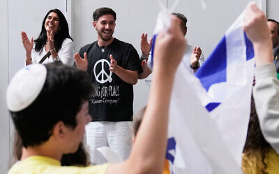 Former hostage Omer Shem Tov, center, celebrates as he is received at Logan Airport in Boston, Massachusetts, May 15, 2025, in Boston. (AP Photo/Charles Krupa)