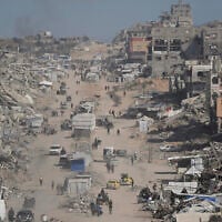Displaced Palestinians flee Beit Lahiya amid ongoing military operations in the Gaza Strip arrive in Jabalia, northern Gaza, May 16, 2025. (AP Photo/Jehad Alshrafi)