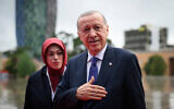 Turkey's President Recep Tayyip Erdogan arrives, with his wife, at the beginning of a summit where the leaders of 47 European countries and organizations are to discuss security, defense and democratic standards, in Tirana, Albania, on May 16, 2025. (Leon Neal/Pool via AP)