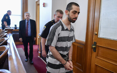 Hadi Matar walks into Chautauqua County court in Mayville, New York, where he was sentenced for 25 years in prison for the 2022 stabbing of author Salman Rushdie, May. 16, 2025. (AP Photo/Adrian Kraus)