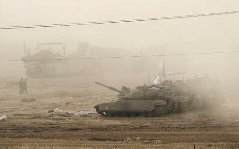 Israeli tanks parked in a staging area in southern Israel, near the border with Gaza, Friday, May 16, 2025. (AP Photo/Maya Alleruzzo)